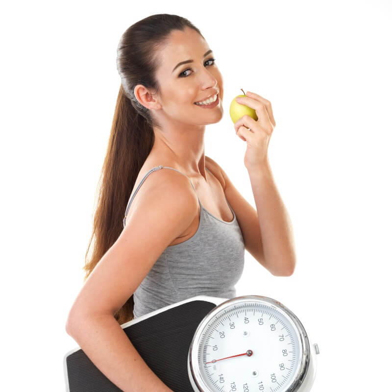 A beautiful woman eating an apple